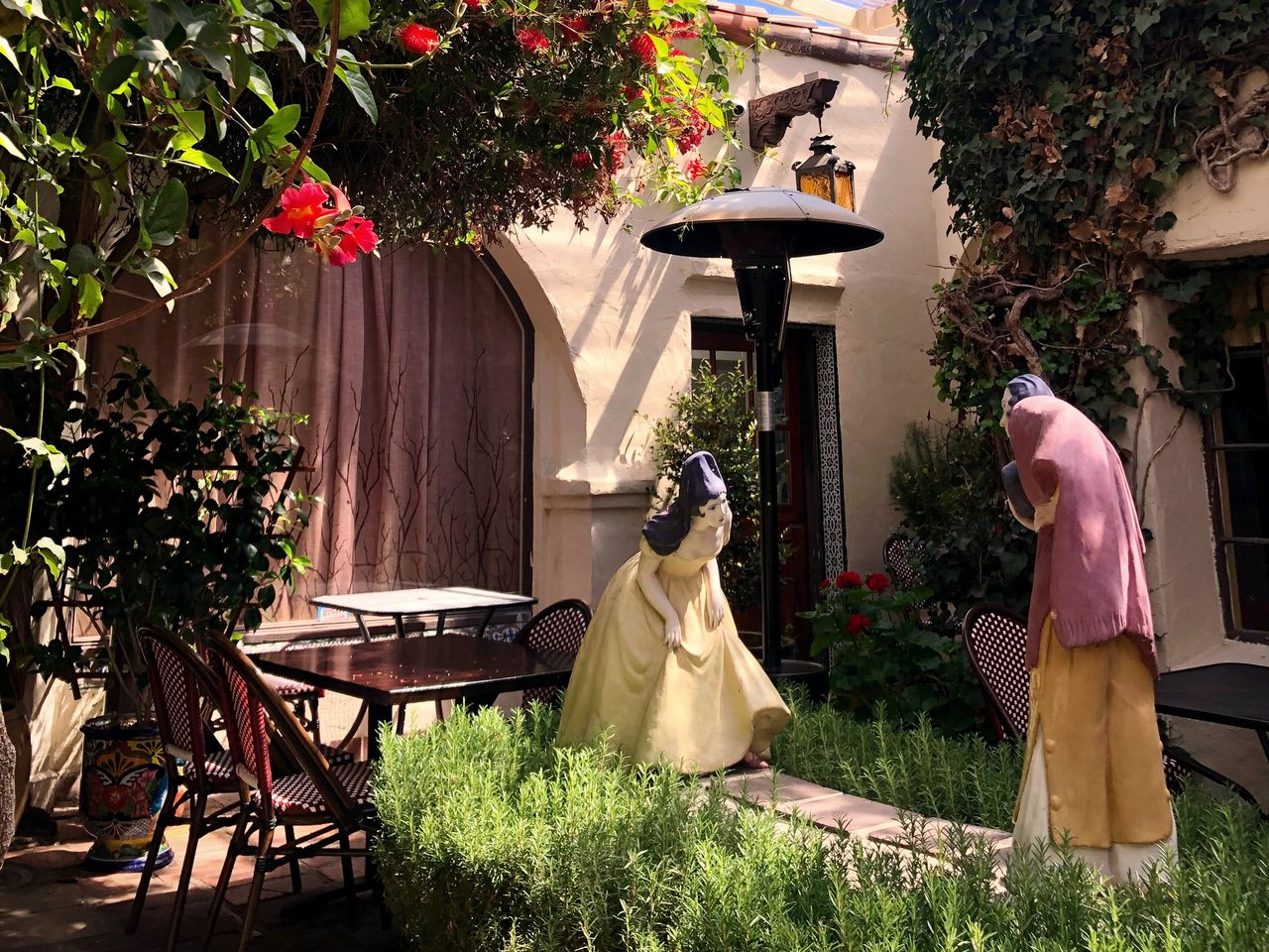 The Greeting sculpture in the Little Napoli courtyard in the afternoon
