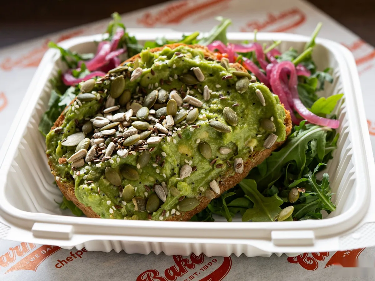Avocado toast with pickled onion and seeds