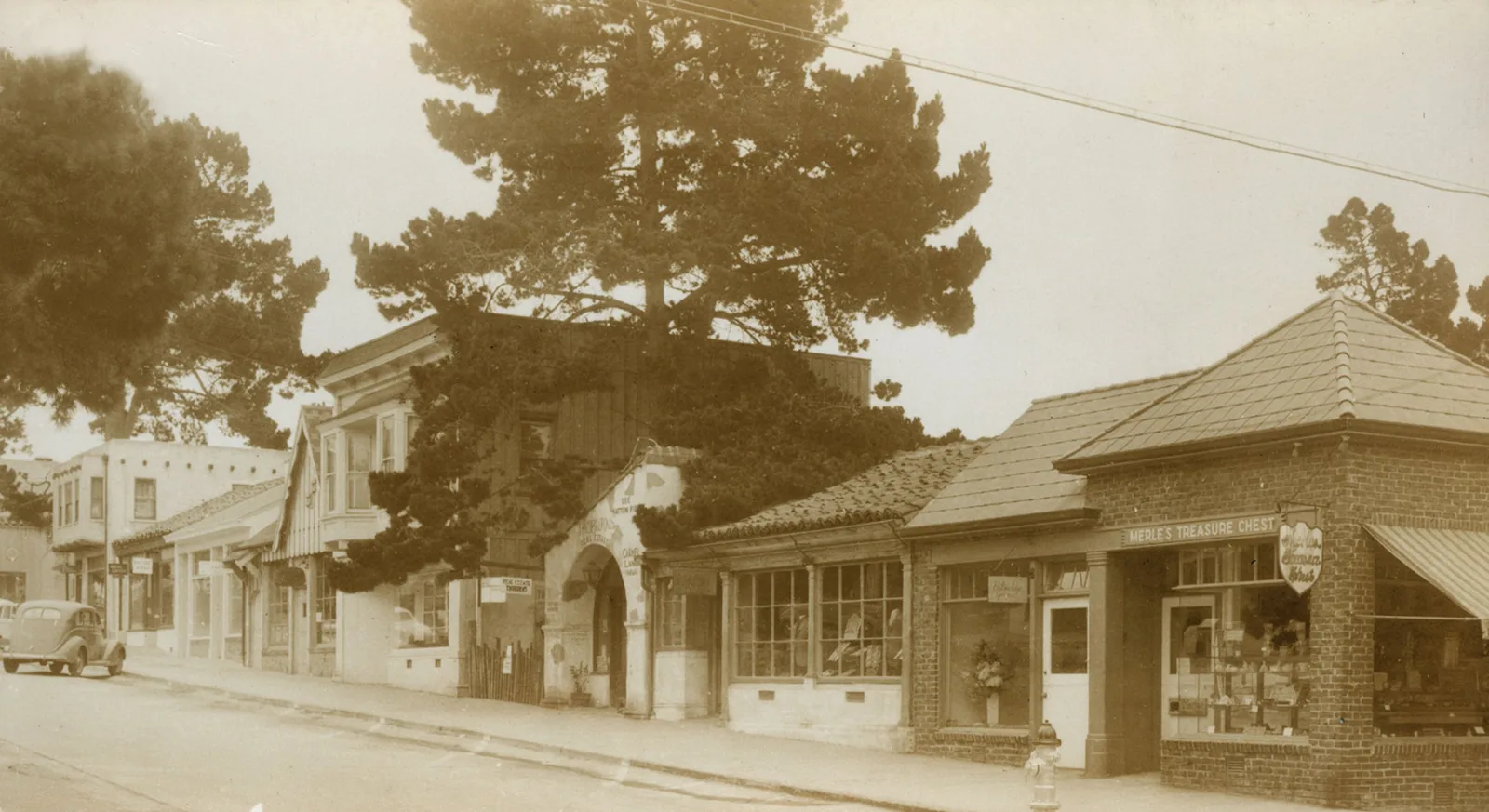 Ocean Avenue in the late 1930s, looking up toward Carmel Bakery, with cars parked at an angle
