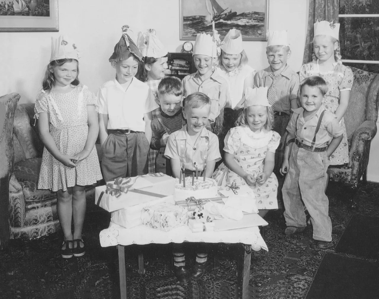 Carmel children around a birthday cake from Carmel Bakery