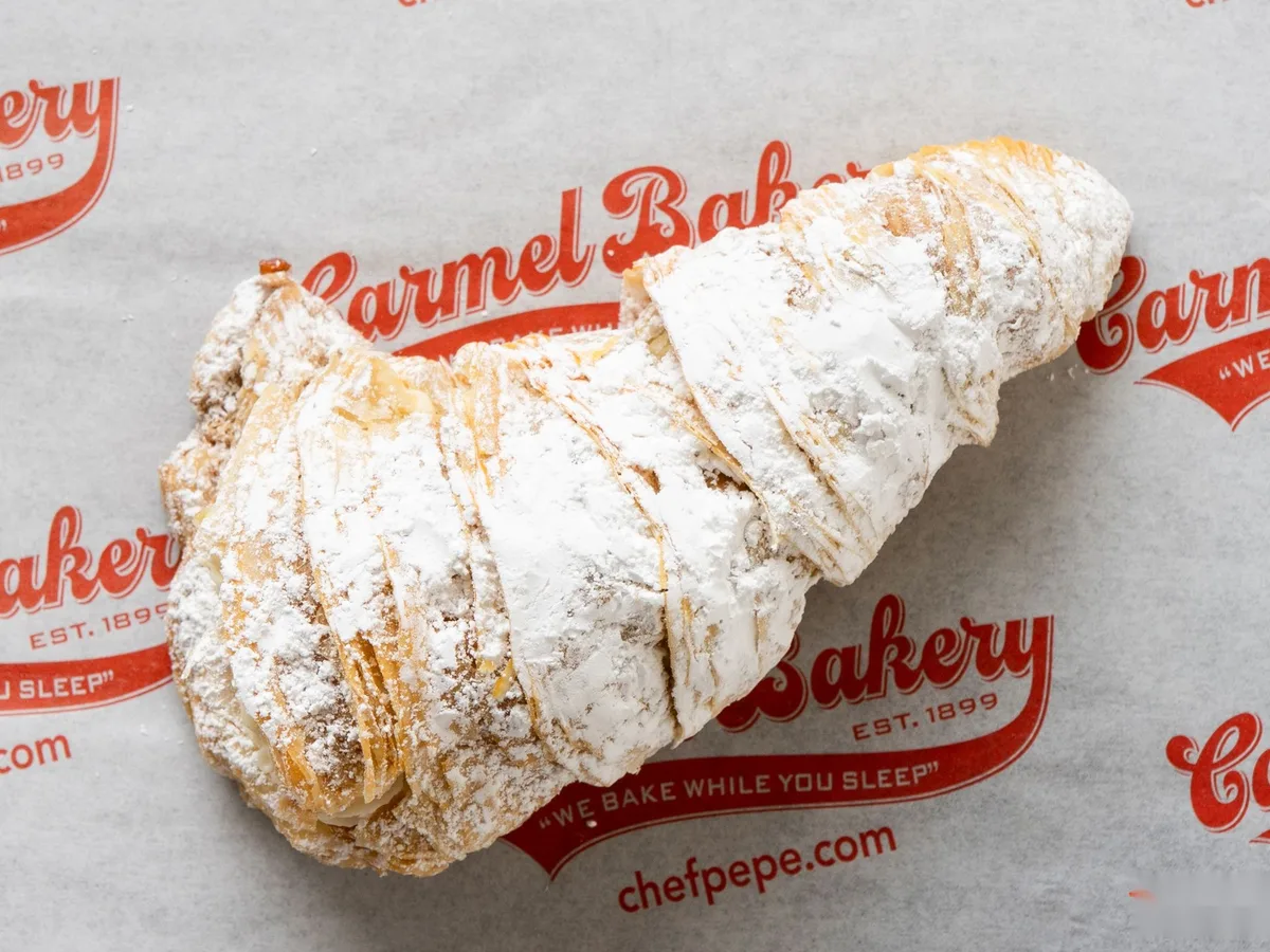 A lobster tail pastry dusted with sugar