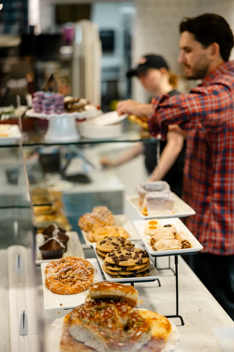 Pastries in the case, with one of us behind it