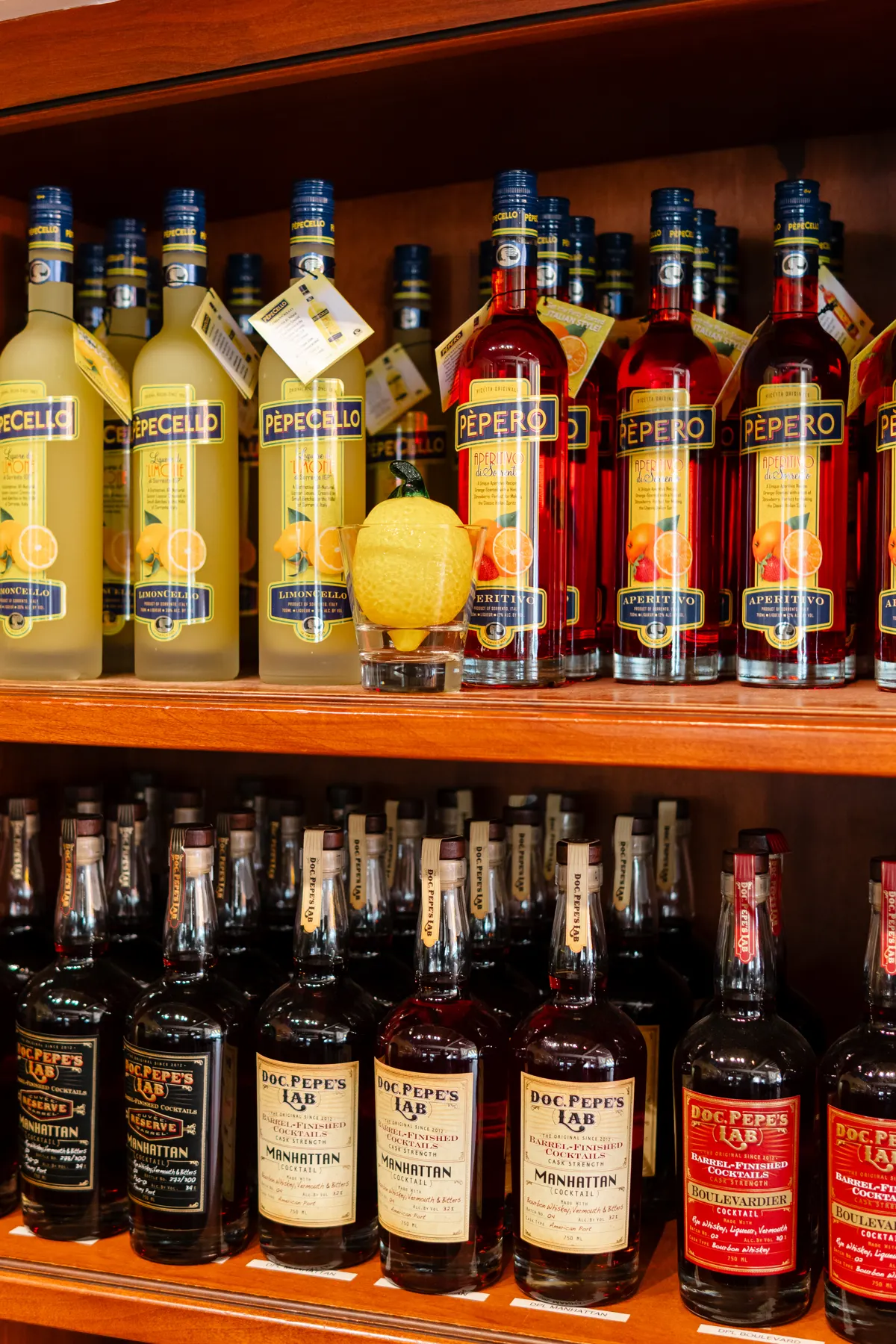Bottles of Pèpecello and Doc Pèpe's Lab spirits on the back bar