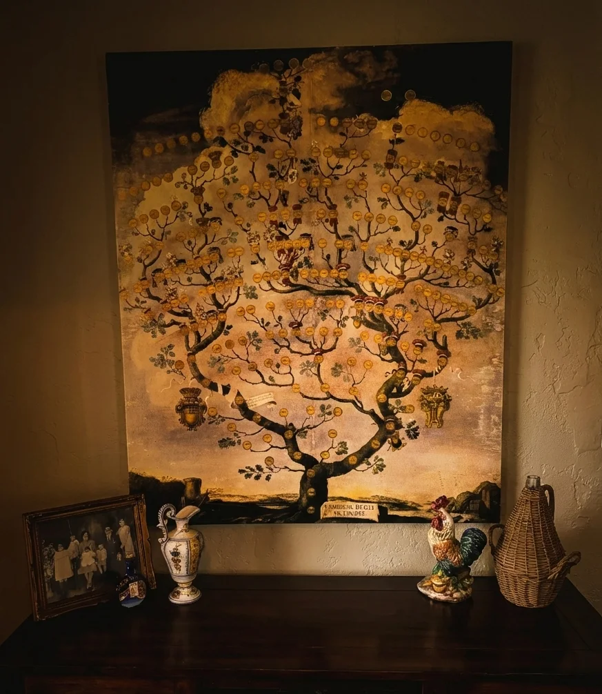 A large painting of a tree over the sideboard in the La Dolce Vita room, in warm light