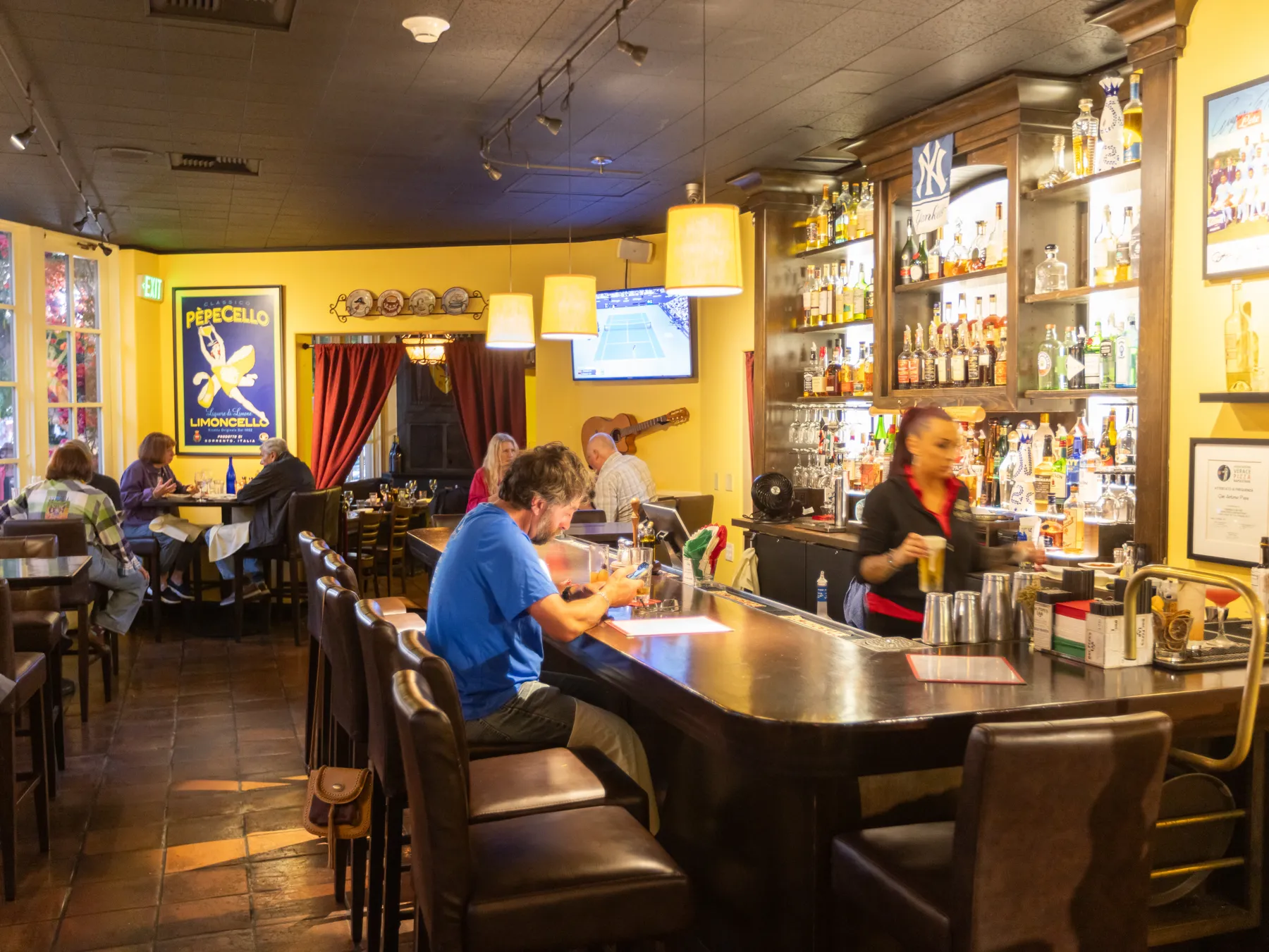 The Downstairs Bar with a bartender and guests